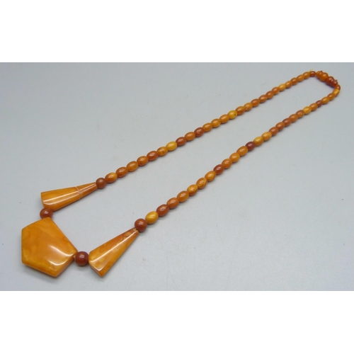 1025 - A butterscotch amber necklet, one bead and clasp a/f, string worn, 44cm