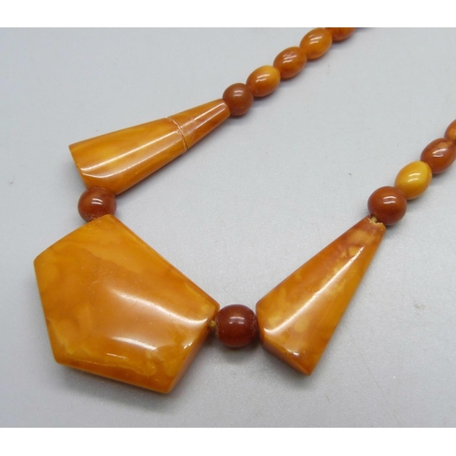 1025 - A butterscotch amber necklet, one bead and clasp a/f, string worn, 44cm