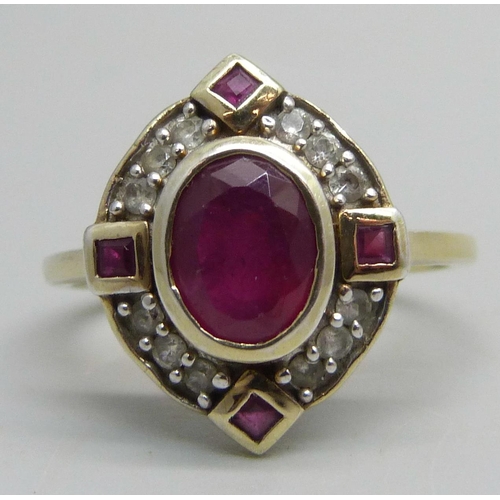 1029 - A lady's silver gilt, ruby and white stone ring, V