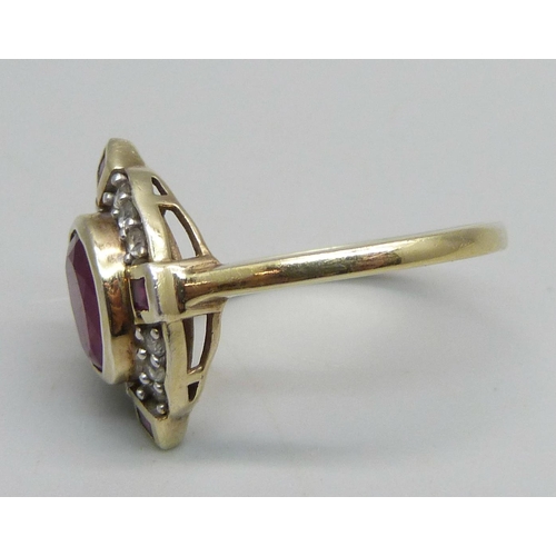 1029 - A lady's silver gilt, ruby and white stone ring, V