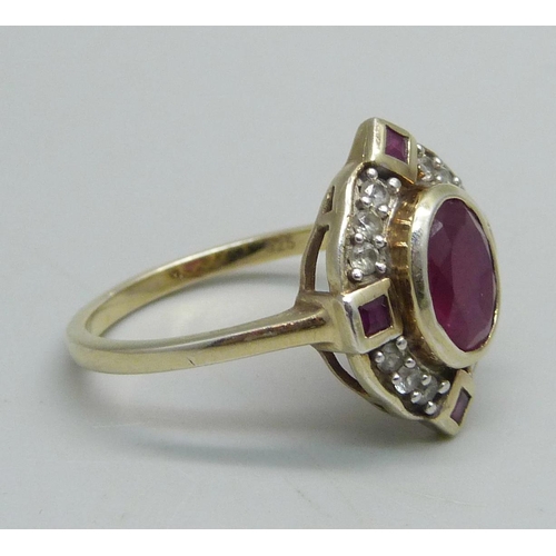 1029 - A lady's silver gilt, ruby and white stone ring, V