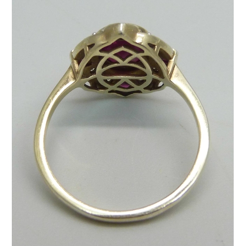 1029 - A lady's silver gilt, ruby and white stone ring, V