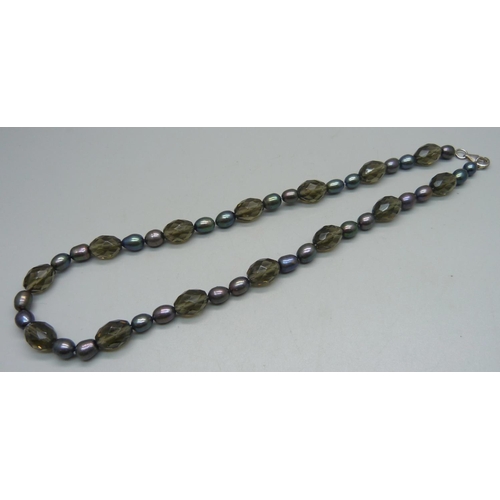 1030 - A silver mounted pearl and smoky quartz colour bead necklace, 46cm