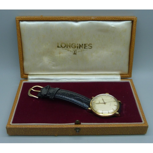 1034 - A Longines 18ct gold wristwatch, 35mm case including crown, with presentation inscription to case ba... 