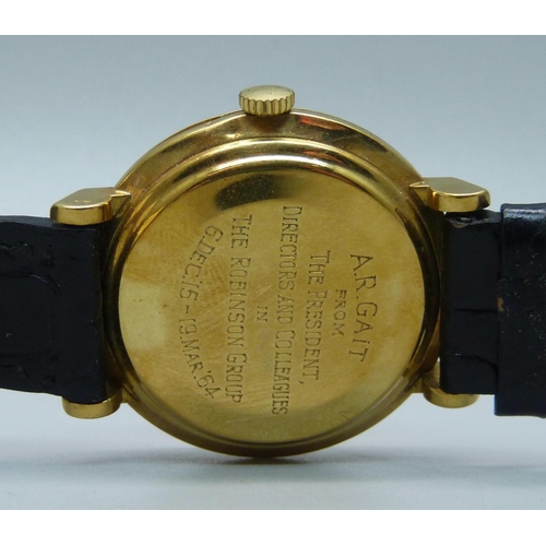 1034 - A Longines 18ct gold wristwatch, 35mm case including crown, with presentation inscription to case ba... 