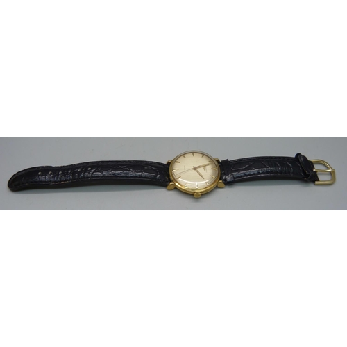 1034 - A Longines 18ct gold wristwatch, 35mm case including crown, with presentation inscription to case ba... 