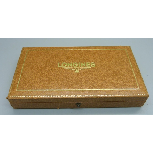 1034 - A Longines 18ct gold wristwatch, 35mm case including crown, with presentation inscription to case ba... 