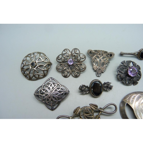 1038 - Two unmarked white metal brooches and eight marked as silver, stone set examples all stamped, 61g to... 