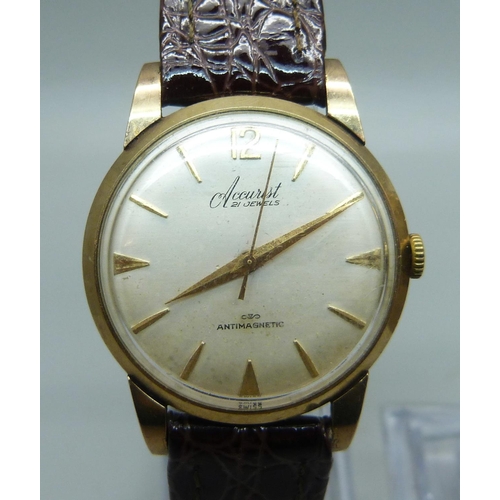 1041 - A 9ct gold cased Accurist wristwatch and an Omega quartz wristwatch head