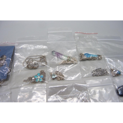 1045 - Twenty silver and silver mounted pendants and chains