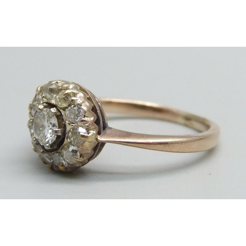 1059 - A yellow metal diamond cluster ring, 2.7g, M