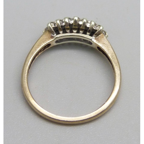 1060 - A 9ct gold ring set with diamonds, one missing, 2.3g, L