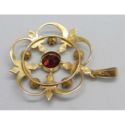 1071 - A 9ct gold pendant set with 6 garnets, 3.1g, 3.7cm drop