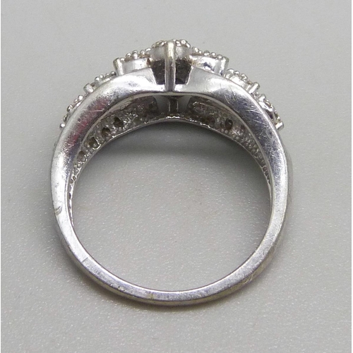 1074 - A 9ct white gold ring set with diamonds, 0.33ct, 3.6g, K