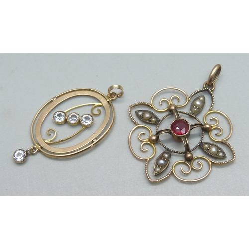 1075 - A 9ct gold pendant set with a garnet and seed pearls, 3.8cm drop, and a 9ct gold pendant set with fo... 