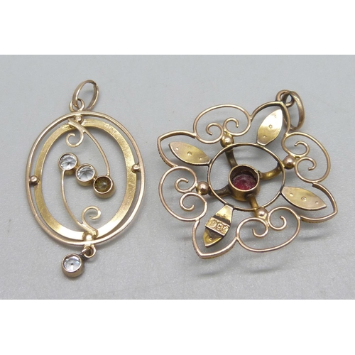 1075 - A 9ct gold pendant set with a garnet and seed pearls, 3.8cm drop, and a 9ct gold pendant set with fo... 