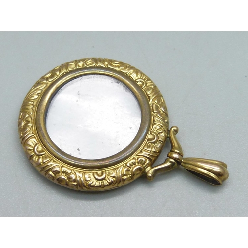 1077 - A 9ct gold photograph locket, 4.5g, 4cm, bale loop a/f