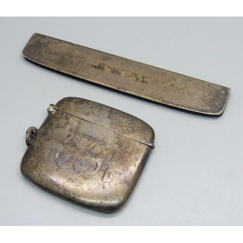 1078 - A silver vesta case with engraved initials, and a silver comb handle, 54g