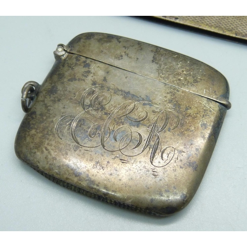 1078 - A silver vesta case with engraved initials, and a silver comb handle, 54g