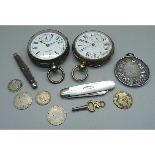 1084 - Two silver pocket watches, one Birmingham 1892 with Waltham movement, a large silver football fob, c... 