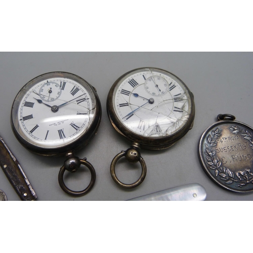 1084 - Two silver pocket watches, one Birmingham 1892 with Waltham movement, a large silver football fob, c... 