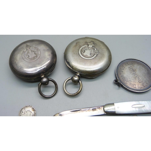 1084 - Two silver pocket watches, one Birmingham 1892 with Waltham movement, a large silver football fob, c... 