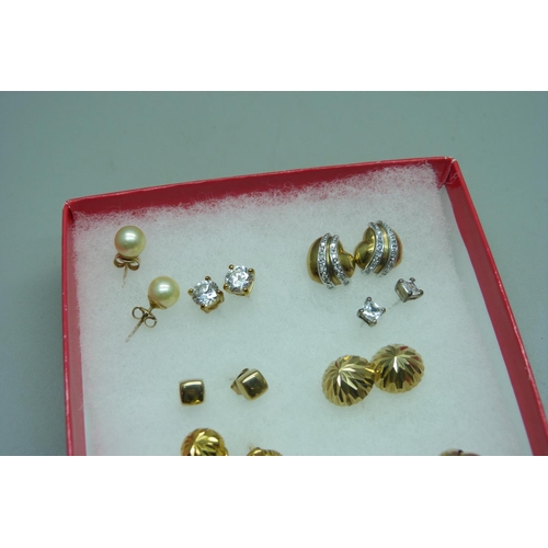 1088 - A pair of 9ct gold knot earrings, a pair of 9ct gold heart shaped earrings set with diamonds, a pair... 