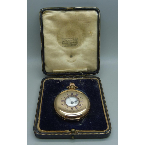 1096 - A 9ct gold cased half hunter pocket watch in a fitted case with long service inscription to case bac... 