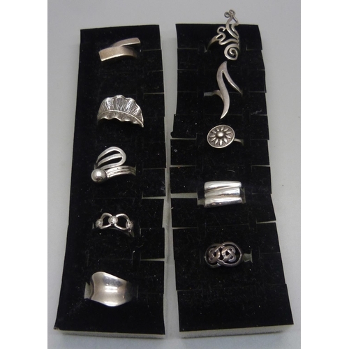 1103 - Ten silver rings, all with purity marks, 57g