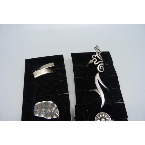 1103 - Ten silver rings, all with purity marks, 57g