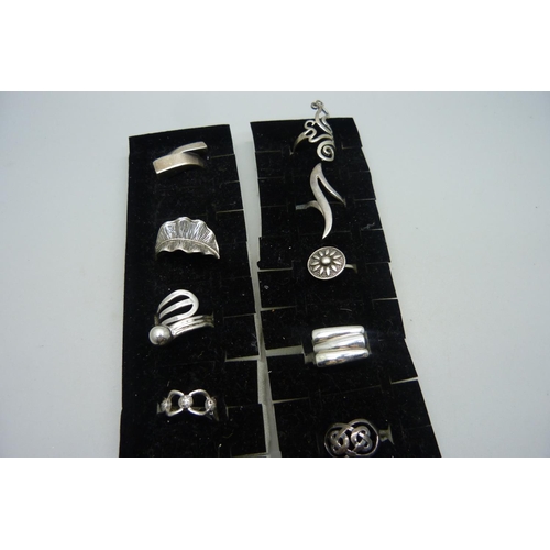 1103 - Ten silver rings, all with purity marks, 57g