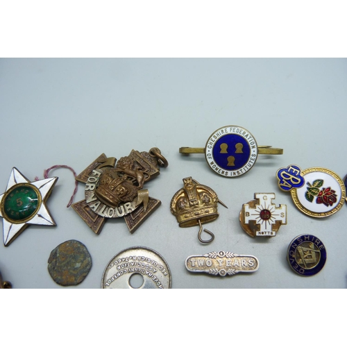 1118 - A collection of military pin badges and other badges including enamel