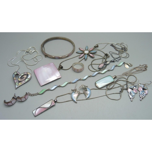 1129 - A collection of silver and mother of pearl jewellery, all stamped as silver, 112g