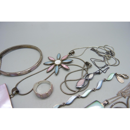 1129 - A collection of silver and mother of pearl jewellery, all stamped as silver, 112g