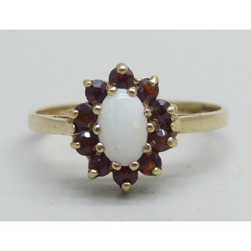 1142 - A 9ct gold, opal and garnet cluster ring, 1.5g, L