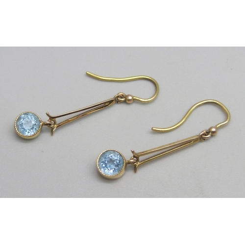 1145 - A pair of yellow metal drop earrings set with aquamarine stones, 1.4g, 3cm drop