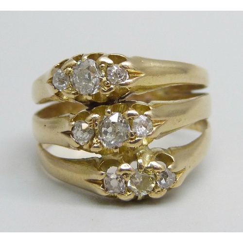 1151 - A yellow metal ring created from three individual diamond trilogy rings, stamped 18ct, 5.3g, M/N