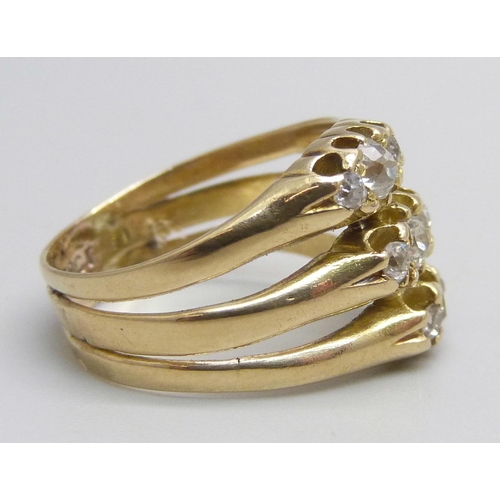 1151 - A yellow metal ring created from three individual diamond trilogy rings, stamped 18ct, 5.3g, M/N