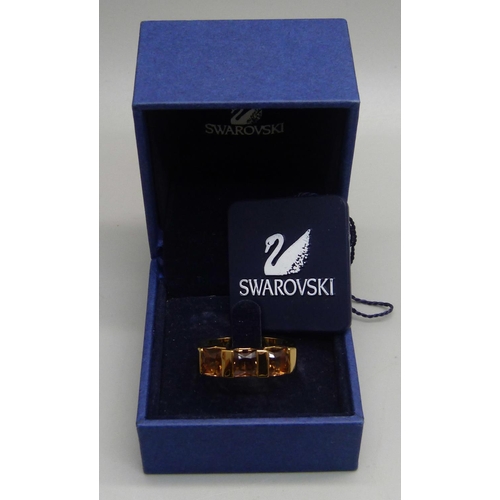 1152 - A Swarovski gem set ring, in original box with tag, R