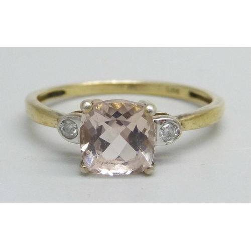 1153 - A silver gilt ring set with a pink stone and two small diamonds, R