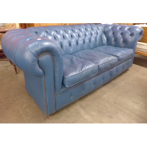 101 - A blue leather Chesterfield settee