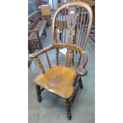 106 - A 19th Century elm and yew wood highback Windsor chair