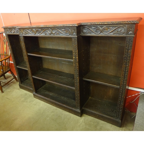 108 - A Victorian Jacobean Revival carved oak breakfront bookcase