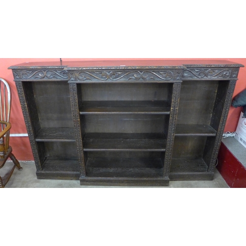 108 - A Victorian Jacobean Revival carved oak breakfront bookcase