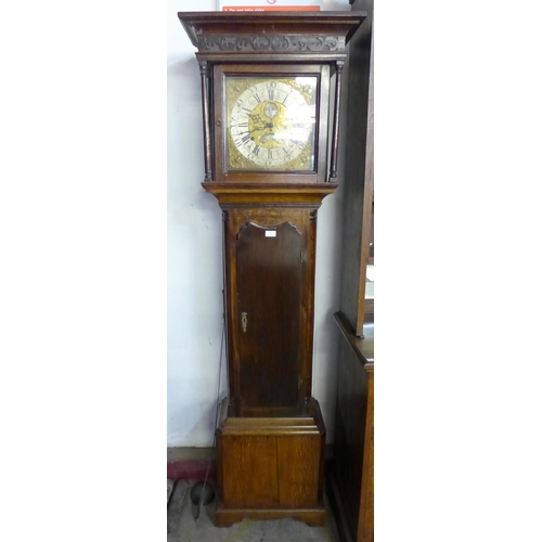 122 - An 18th Century oak 8-day longcase clock, the brass moon-phase rolling dial signed Thomas Knowles