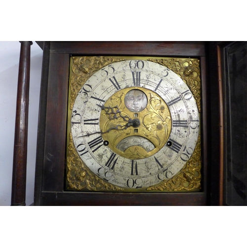 122 - An 18th Century oak 8-day longcase clock, the brass moon-phase rolling dial signed Thomas Knowles