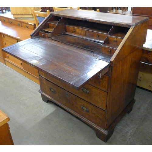 124 - A Queen Anne figured walnut bureau