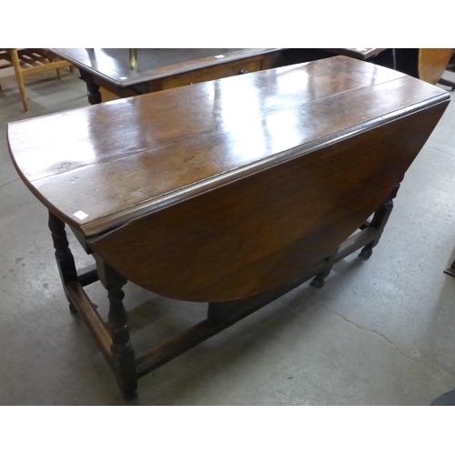 133 - A George I oak gateleg dining table