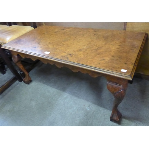 147 - A Queen Anne style burr walnut coffee table