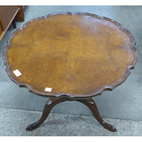 148 - A George III style walnut tripod table